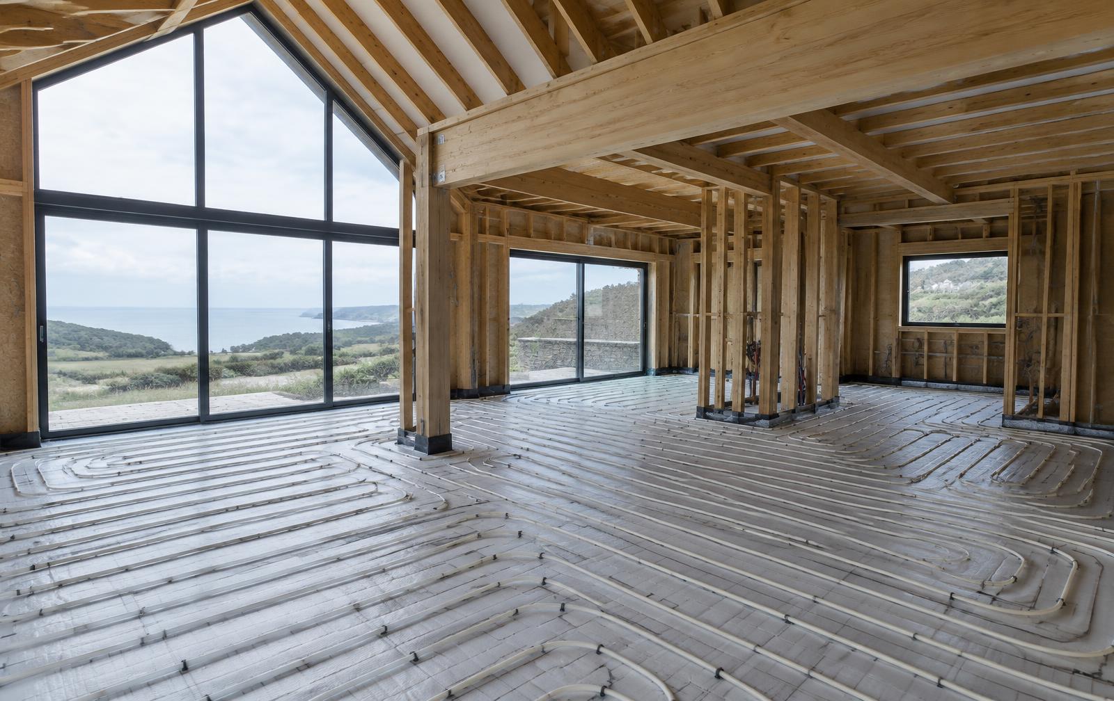 Illustrative image of underfloor heating pipework laid in a timber-framed home under construction